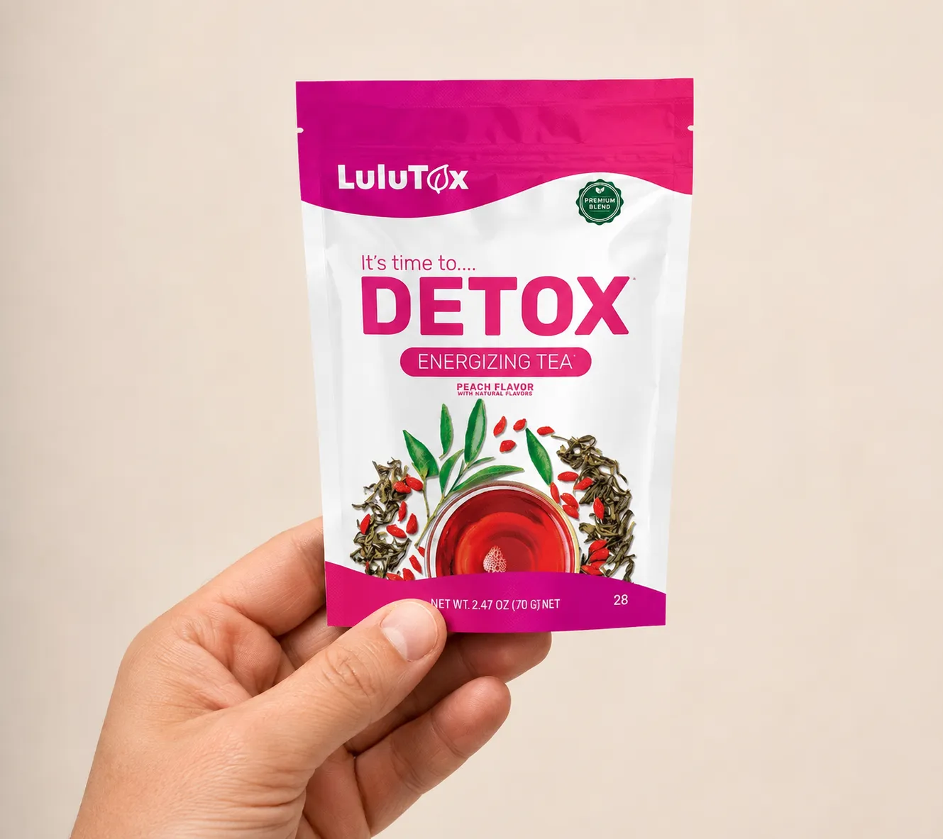 Lulutox Detox Tea HCTC — the package held in a hand